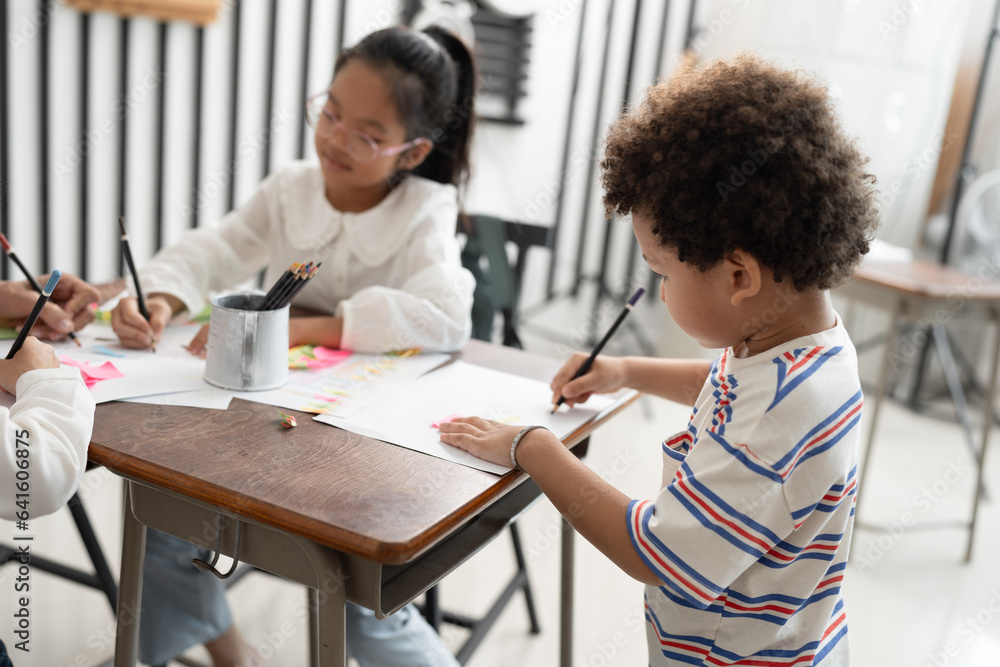 Student African American kid boy studying with friend and teacher in classroom Student African American kid boy studying with friend and teacher in classroom