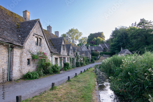 Bibury, Cotswolds, United Kingdom, Europe. Street with old stone houses.  photo