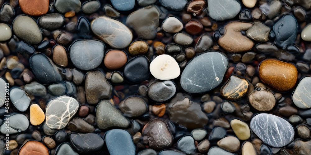River rocks or stones in a small creek or stream with water flowing. Seamless tiled pattern. Naturally polished and rounded river pebbles create a repeating background texture. River rocks or stones in a small creek or stream with water flowing. Seamless tiled pattern. Naturally polished and rounded river pebbles create a repeating background texture.