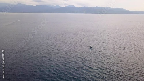 Aerial view of Gili Trawangan sea, West Nusa Tenggara. Panoramic showcasing sea waves natural beauty.
