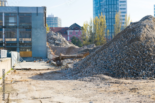 Large hills and piles of sand, gravel, crushed stone of white, gray and black color.