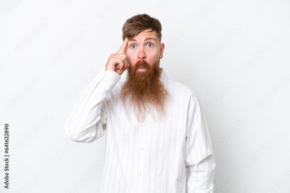 Redhead man with long beard isolated on white background thinking an idea Redhead man with long beard isolated on white background thinking an idea