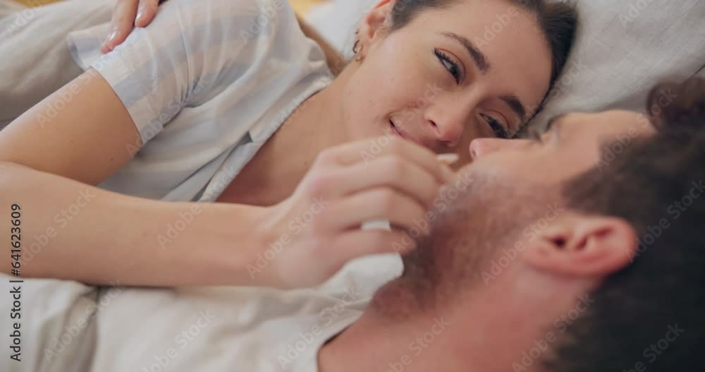 Face, love and smile with a couple in bed together to relax in the morning of a weekend for romance. Happy, cute and a woman with her husband in the bedroom of a home closeup for relationship bonding Face, love and smile with a couple in bed together to relax in the morning of a weekend for romance. Happy, cute and a woman with her husband in the bedroom of a home closeup for relationship bonding