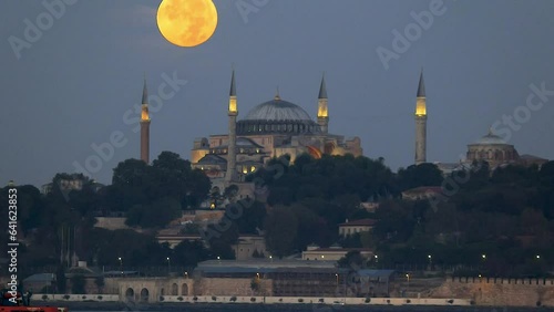 Istanbul Turkey  08 30 2023 timelapse of super full moonset on top of hagia sophia at morning