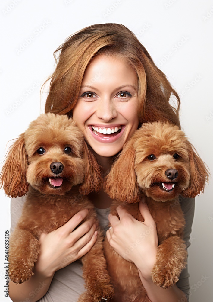 Happy female with two red-brown toy poodle dogs Happy female with two red-brown toy poodle dogs