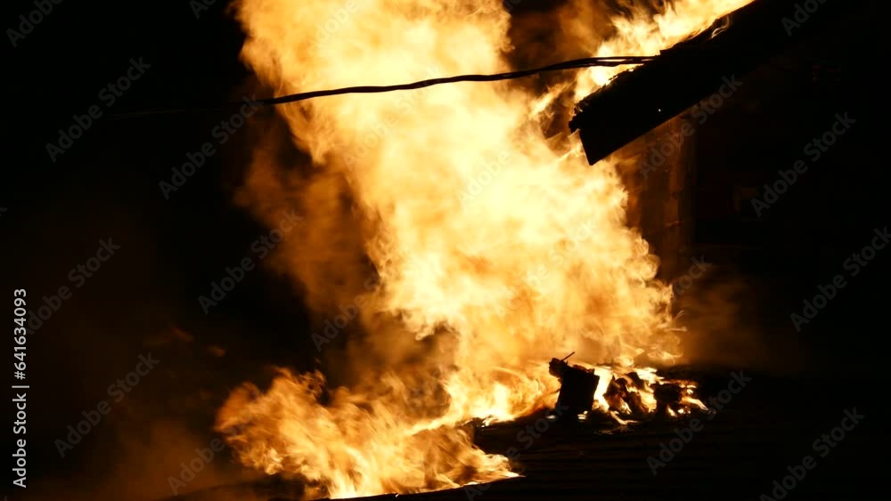 Blazing Fire Over Burning Abandoned Wooden House In Brampton, Ontario, Canada. Static Shot Blazing Fire Over Burning Abandoned Wooden House In Brampton, Ontario, Canada. Static Shot