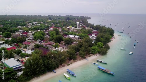 Aerial view of Gili Trawangan, West Nusa Tenggara. Panoramic showcasing architecture, coastal, boats, beach, and natural beauty.