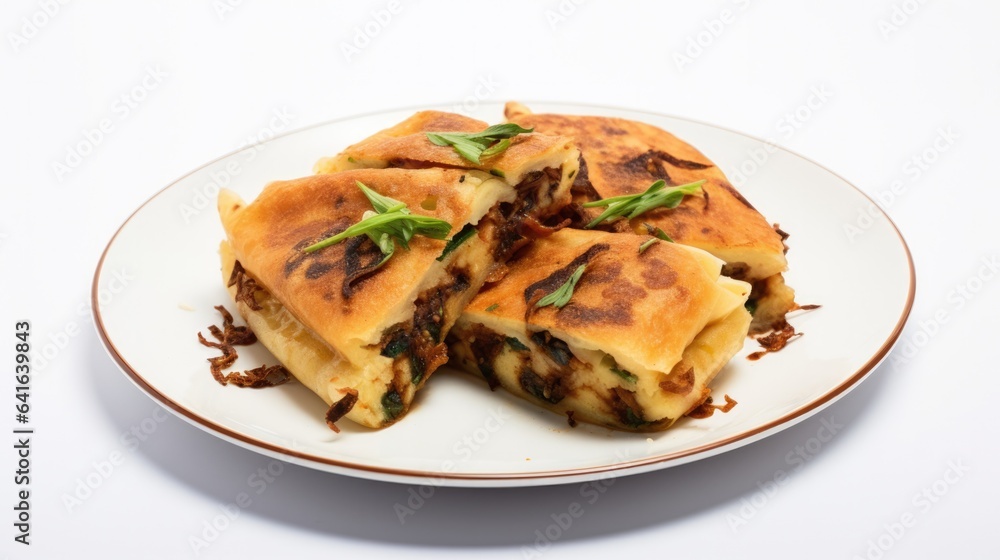 Martabak in a plate on white background