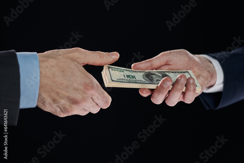 exchange of money cards between businessmen, close-up