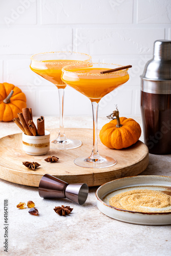 Halloween  Thanksgiving or fall cocktail pumpkin martini  homemade festive seasonal drink pumpkintini with cinnamon