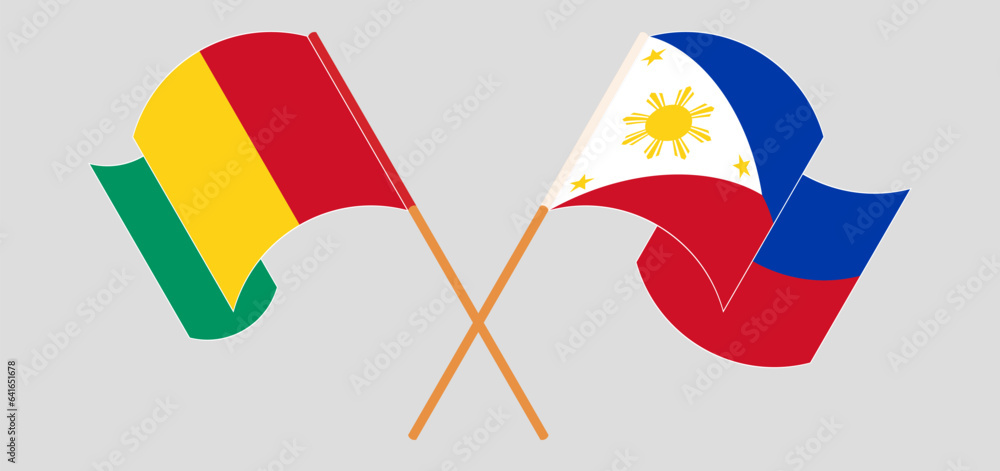 Crossed and waving flags of Guinea and the Philippines Crossed and waving flags of Guinea and the Philippines