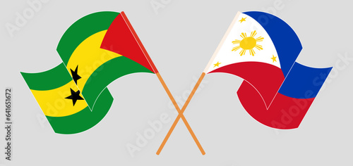 Crossed and waving flags of Sao Tome and Principe and the Philippines