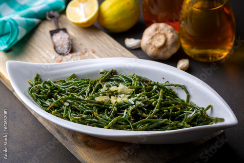 Sea beans and green meze on table. Turkish name; Deniz borulcesi mezesi photo