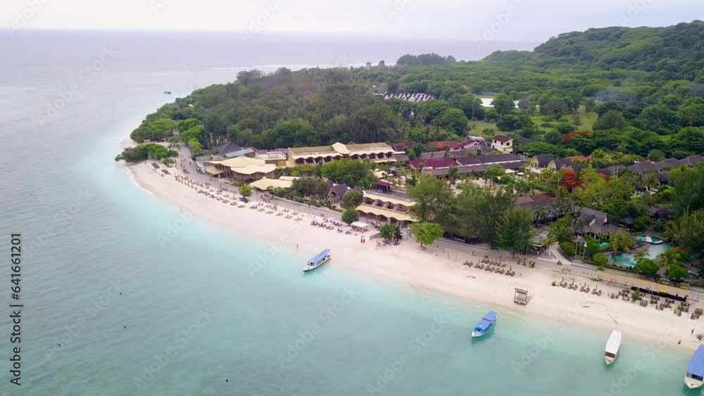 Aerial view of Gili Trawangan, West Nusa Tenggara. Panoramic showcasing architecture, coastal, boats, beach, and natural beauty. Aerial view of Gili Trawangan, West Nusa Tenggara. Panoramic showcasing architecture, coastal, boats, beach, and natural beauty.