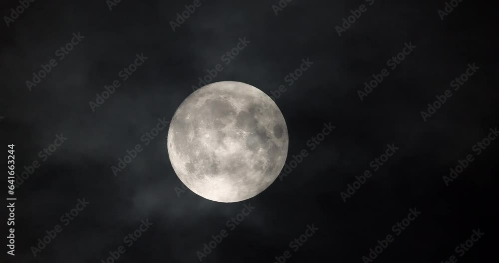 Super blue moon and clouds in the night sky Super blue moon and clouds in the night sky