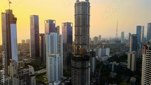 Aerial View of modern City high-rise skyscraper buildings in Mumbai city. Drone shot of Financial District in Mumbai. Downtown Mumbai City, India with high rise towers and Bandra Worli sealink