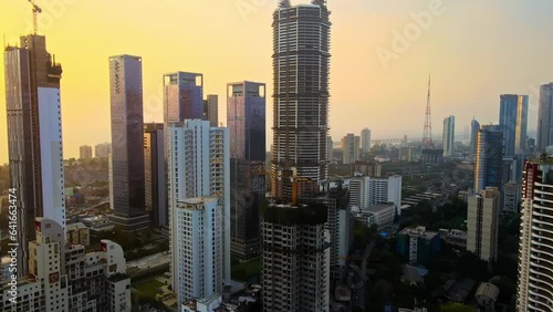 Aerial View of modern City high-rise skyscraper buildings in Mumbai city. Drone shot of Financial District in Mumbai. Downtown Mumbai City, India with high rise towers and Bandra Worli sealink photo