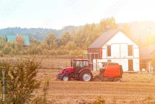 Tractor Cultivating Fields at Sunset. Combine harvester at work. Agricultural industrial. Golden Hour Farming.