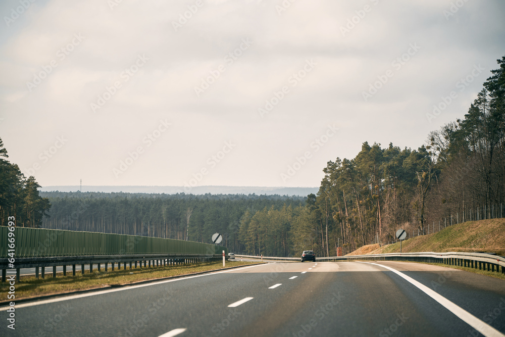 Mountain road landscape. road scene in colorful nature. Nature landscape on beautiful highway. car driving on the highway in summer. stunning highway scenery in europe. Mountain road landscape. road scene in colorful nature. Nature landscape on beautiful highway. car driving on the highway in summer. stunning highway scenery in europe.