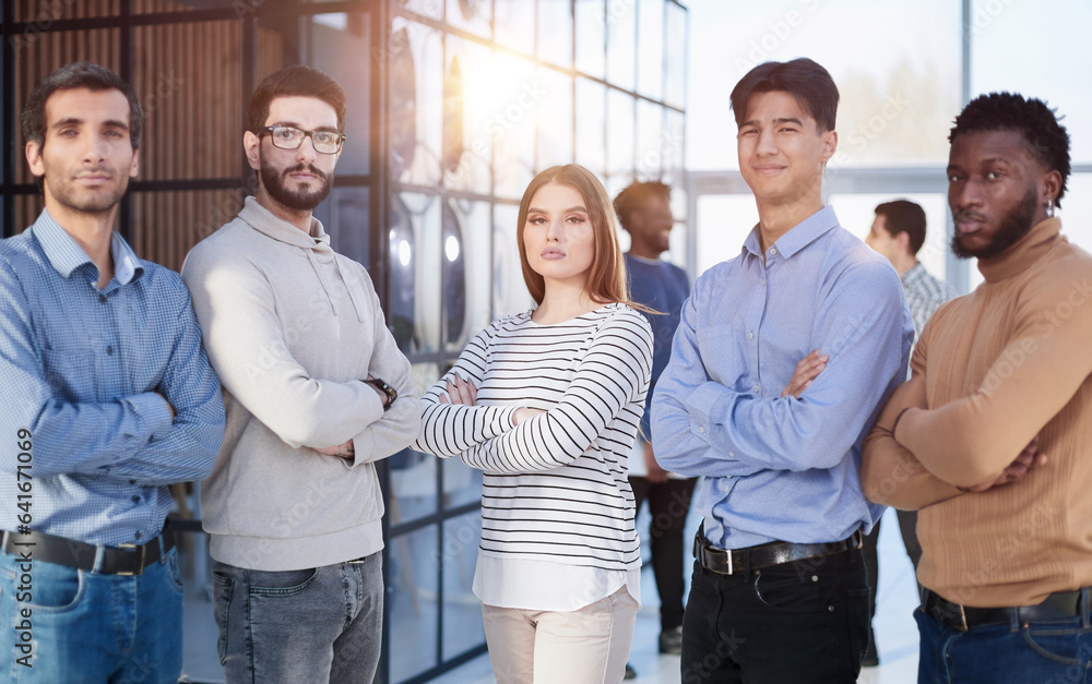 Multiracial business team standing in the office Multiracial business team standing in the office