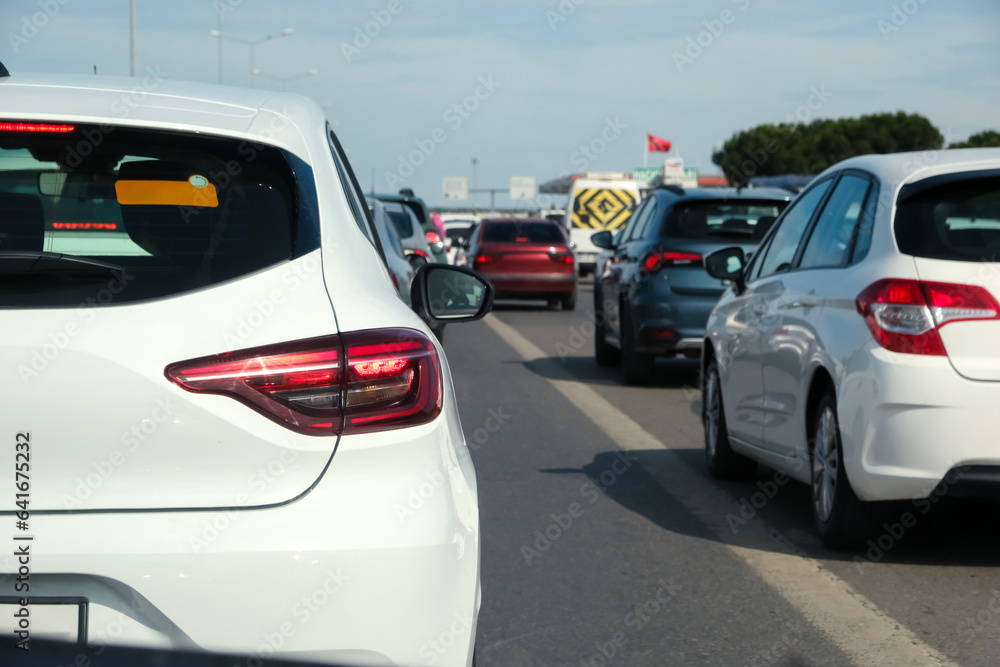 Cars on highway in traffic jam on the road