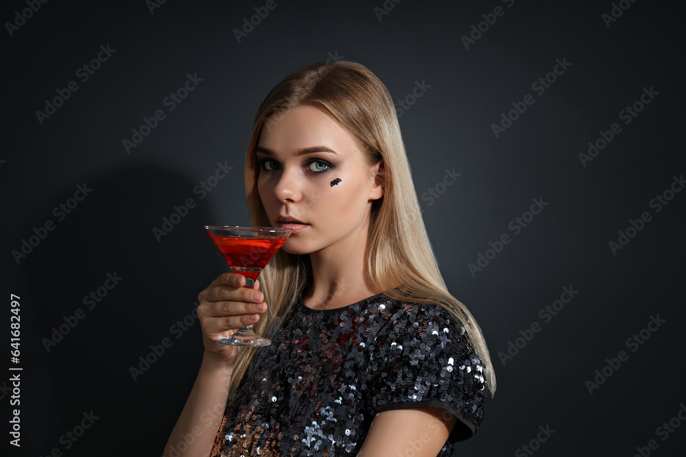 A girl at a party in the style of Halloween with a cocktail in her hands A girl at a party in the style of Halloween with a cocktail in her hands