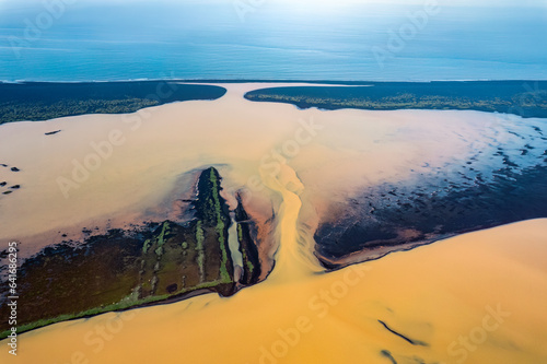Slika na platnu Yellow river tributary sulfur rich sediment from the volcanic area flowing throu