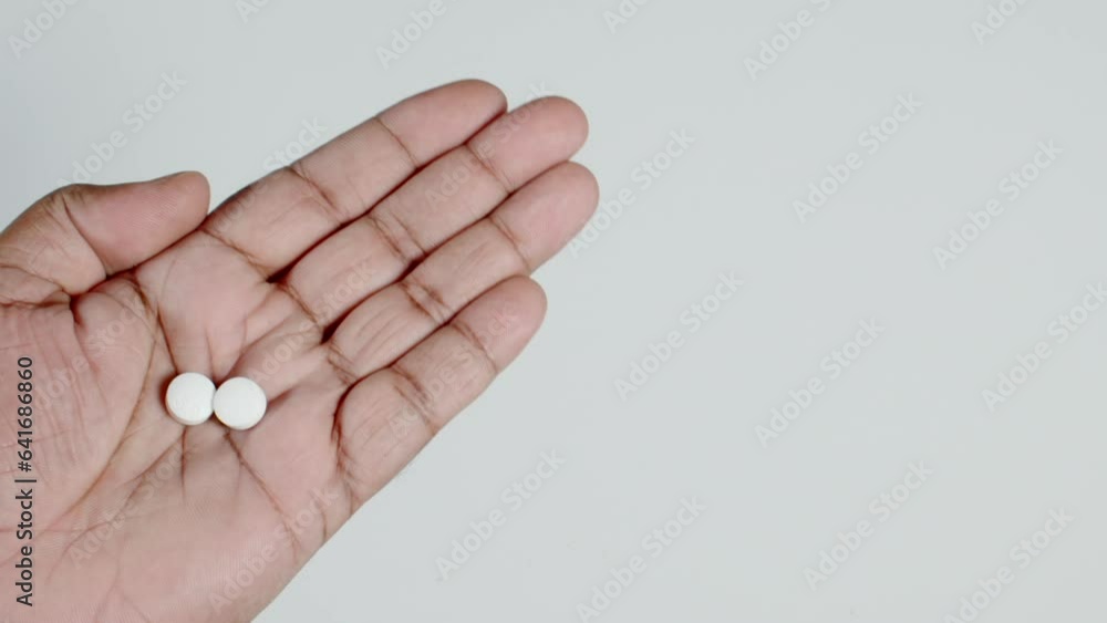 Two White Pills In a Hand Two White Pills In a Hand