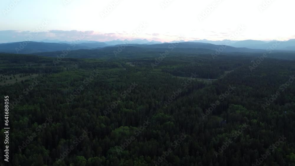 Flyover the endless forest just before sunset in summertime. Canada, Alberta. Flyover the endless forest just before sunset in summertime. Canada, Alberta.