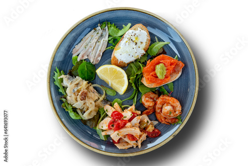 Round dish with mixed Friulian fish appetizer
