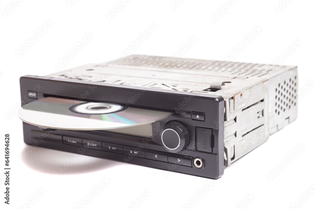 Fototapeta premium Old car radio with cd disk isolated on white background