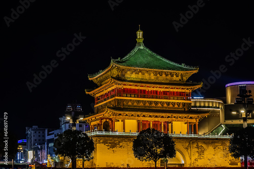 Night scene of illuminated Bell Tower of Xi'an (1384) -is a symbol of the city of Xi'an and one of the grandest of its kind in China. XI’AN, CHINA.