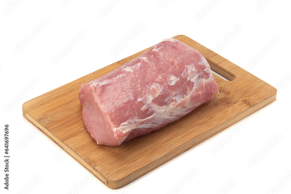 Fresh piece of raw pork meat on wooden cutting board over white background. Fresh piece of raw pork meat on wooden cutting board over white background.