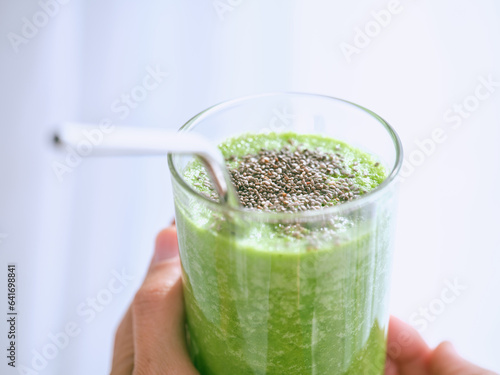 Anonymous person with smoothie with chia