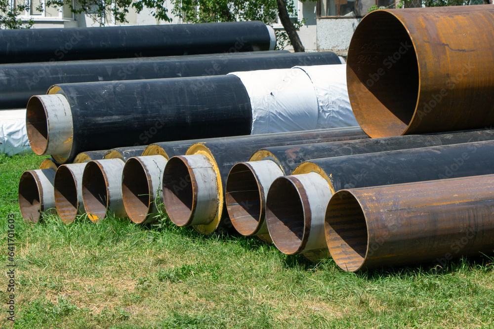 Many pipes for water supply lie on the ground Many pipes for water supply lie on the ground