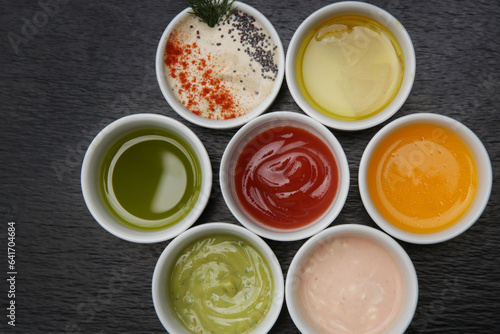 Different sauces and dips in bowls on the restaurant table