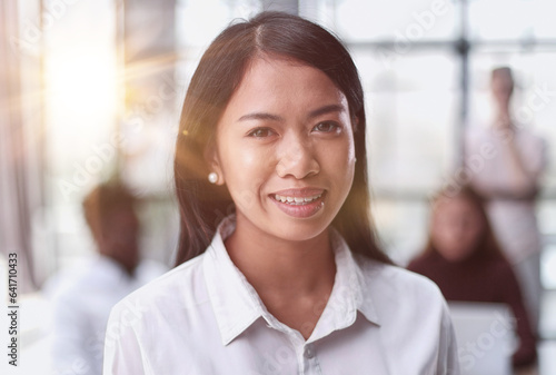 Young beautiful Asian business woman consultant , portrait of an employee looking at the camera