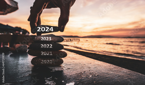 Happy new year 2024 replace old 2023. New Year 2024 is coming concept idea on orange sky. High resolution creative photo image can be used as large display, print, website banner, social media post.	