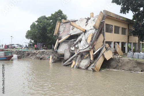 Vast areas of Manikganj are affected by river erosion in Bangladesh
A portion of Char Mukundia Government Primary School collapses into the Padma as river erosion has taken a severe turn in Manikganj  photo