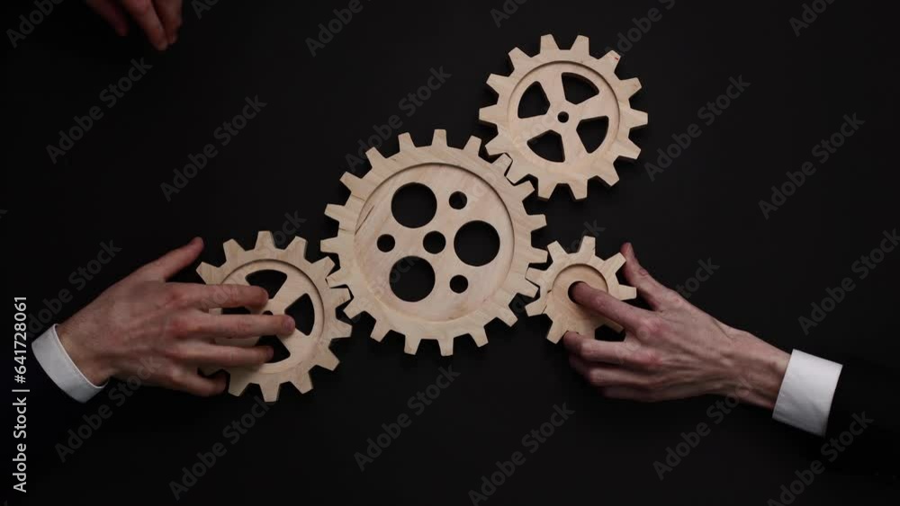Two businessmen shaking hands on a black background Two businessmen shaking hands on a black background