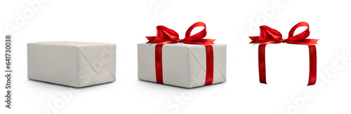 Photographie A side view of a wrapped Christmas present with a red bow made from ribbon isolated against a transparent background with spare ribbon to the right