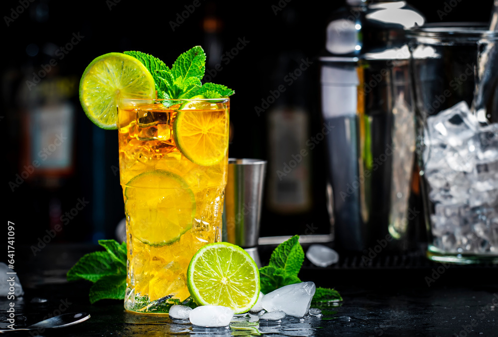 Dark and Stormy cocktail drink with dark rum, ginger ale, lime and ice