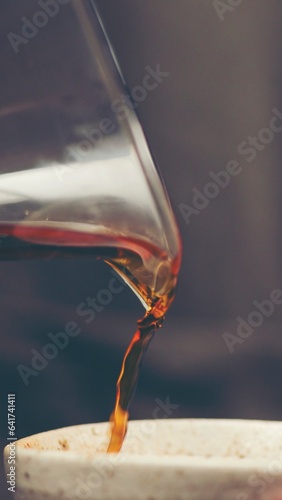 Coffee beans with spoon and glass ready to be served