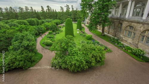 Wallpaper Mural Garden near Antique Gallery and Sculptures: Catherine Park Timelapse in Saint-Petersburg, Russia. Exploring the Elegant Garden, Adorned with Floral Compositions, Trees and Bushes, on Cloudy Summer Day Torontodigital.ca