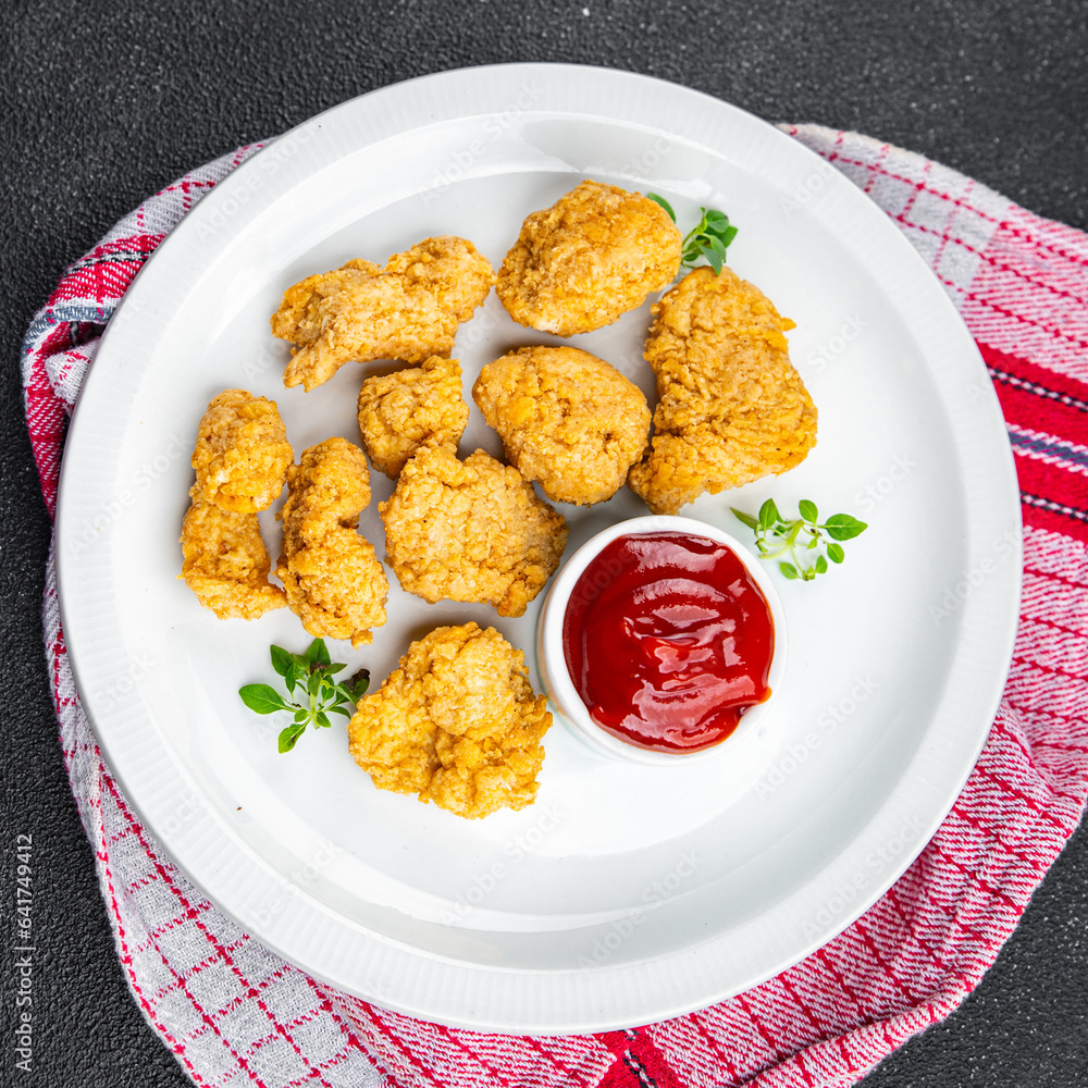 chicken nuggets tomato sauce deep-fried meat ready to eat healthy meal food snack on the table copy space food background rustic top view chicken nuggets tomato sauce deep-fried meat ready to eat healthy meal food snack on the table copy space food background rustic top view