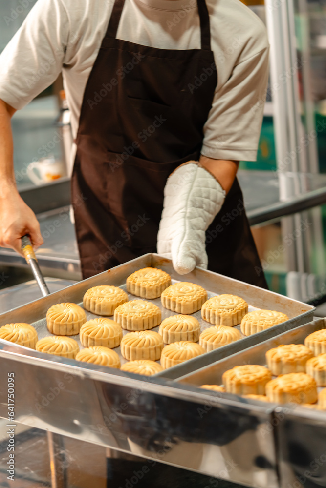 Mooncake making process. A mooncake is a Chinese bakery product traditionally eaten during the Mid-Autumn Festival. Mooncake making process. A mooncake is a Chinese bakery product traditionally eaten during the Mid-Autumn Festival.