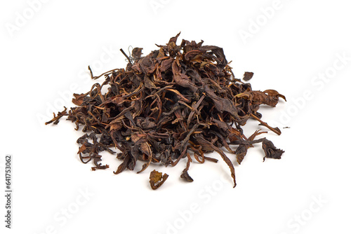 Dry black tea leaves, isolated on white background.