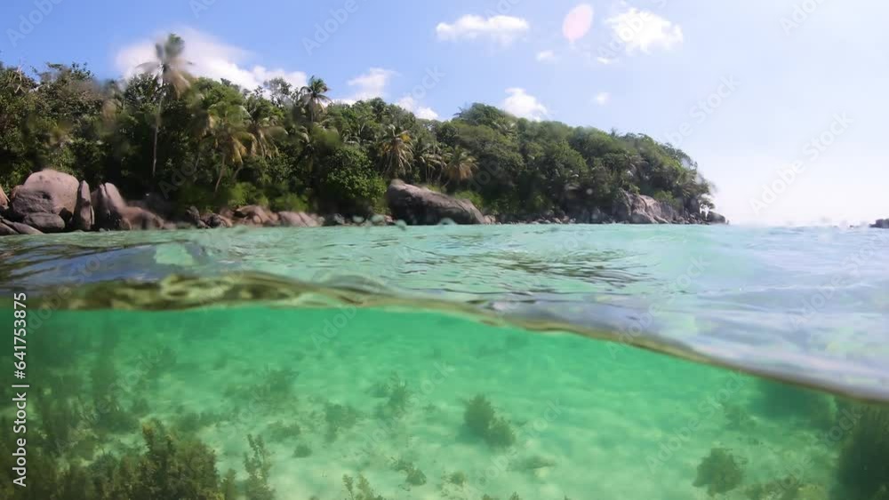 Split underwater view of Anse Royale beach. Mahe island, Seychelles