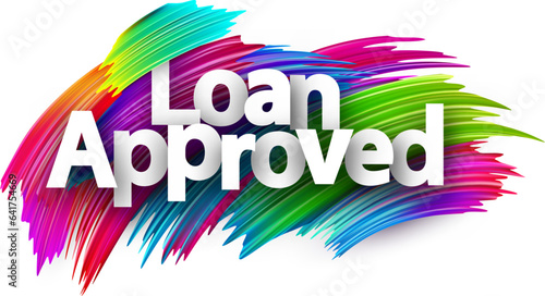 Loan approved paper word sign with colorful spectrum paint brush strokes over white.