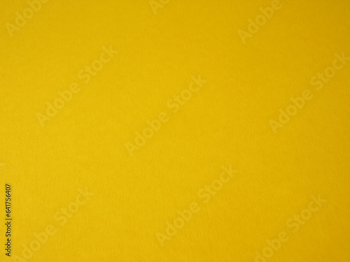 Background of rough paper in yellow color